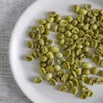 green coffee beans in a plate